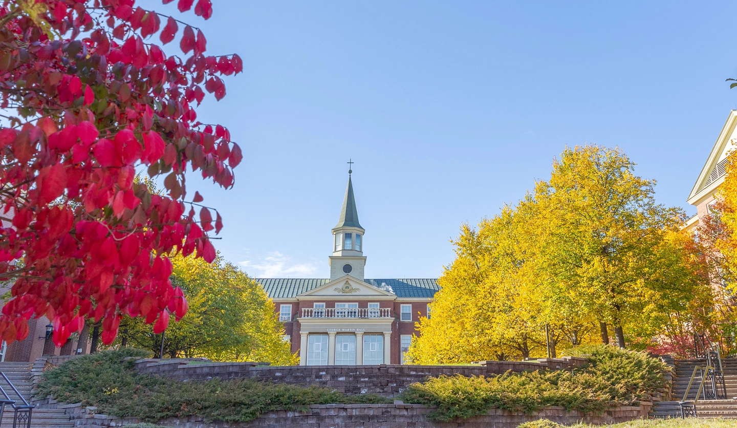 George Martin Hall surrounded by colourful leaves