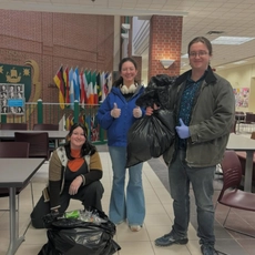 students holding bags of bottles