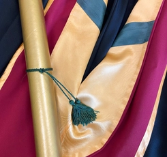 Gown, hood, and diploma