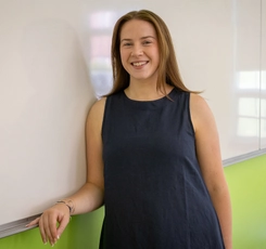 Fiona McMaster, BEd'26, standing at whiteboard in a classroom