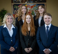 Aurora Sutton, Jazmyne Lebel, Sydney Gallibois, Edyn Clowater, and Alex Ryan in the Great Hall