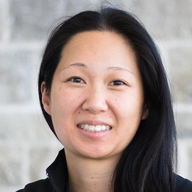 A woman wearing a black sweatshirt.