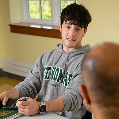 Student talking with professor