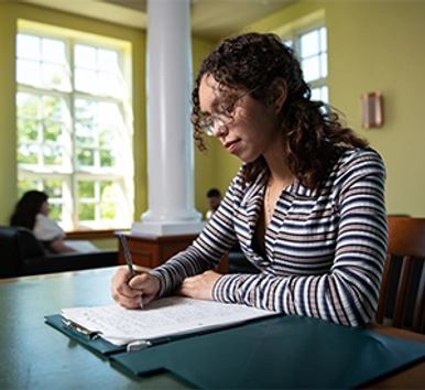 Student taking notes