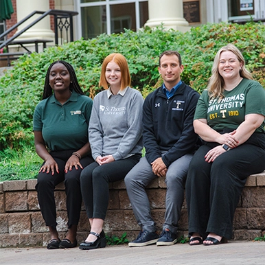 Four admission counsellors sitting together for group picture