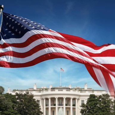 white house with an american flag flying
