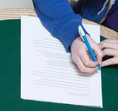 Photo of a student taking notes