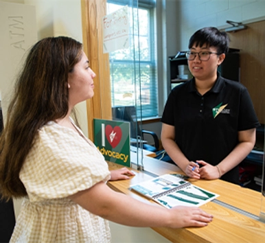 Student asking questions at the Student Union Help Desk