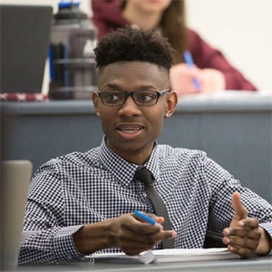 A student speaking in a classroom