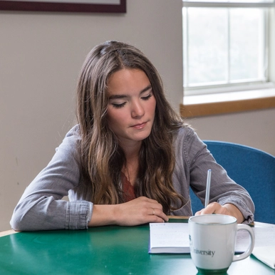 Student writing a letter