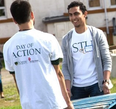 A photo of two students volunteering at a STU Cares event