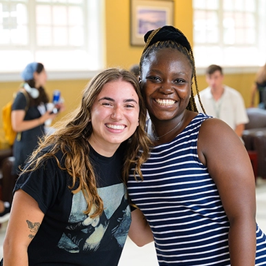 Two students smiling at STUISA event