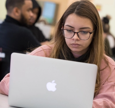 Photo of a student on a laptop