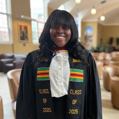 A Black Student wearing a Kente Stole