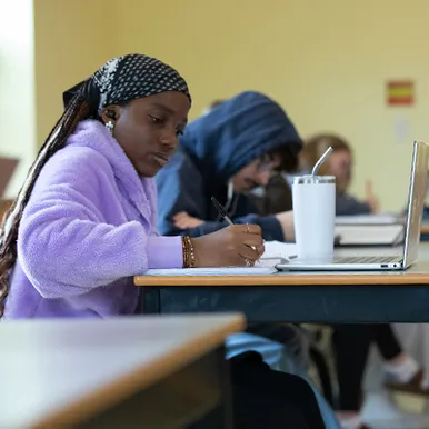 Students taking notes in class