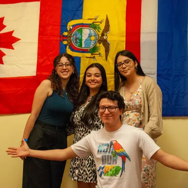 Students standing in front of flags