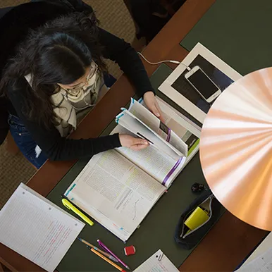 Top down view of student studying and doing homework