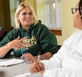 students chatting in a classroom