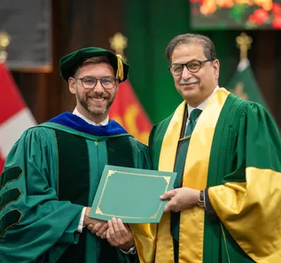Professor getting an award from the President