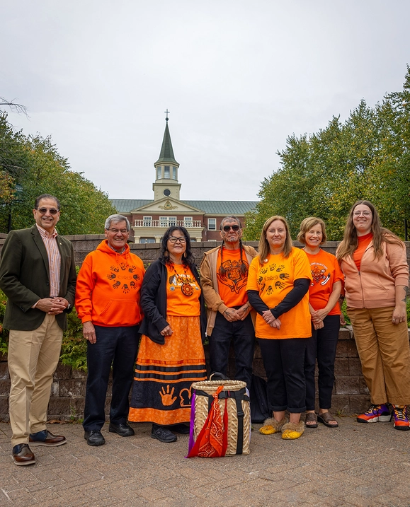 Members of the STU community stand in their 