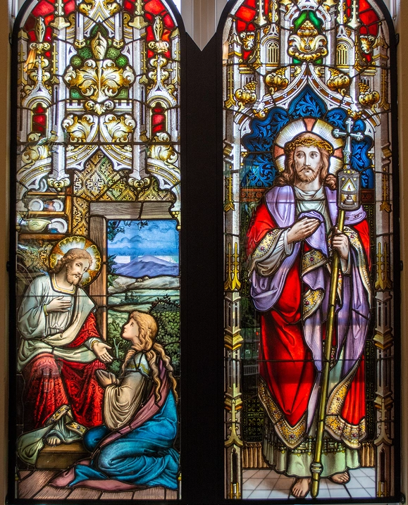 Two panels of stained glass windows depicting Jesus with Mary and Jesus as light of the world.