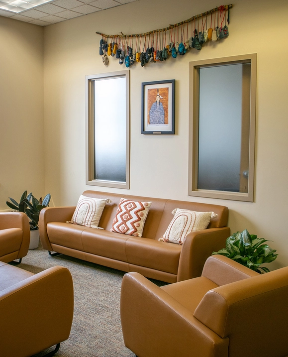 Four couches in a circle on a carpet