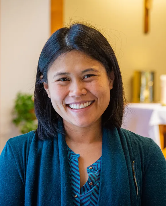Claire Morrison stands in the STU chapel