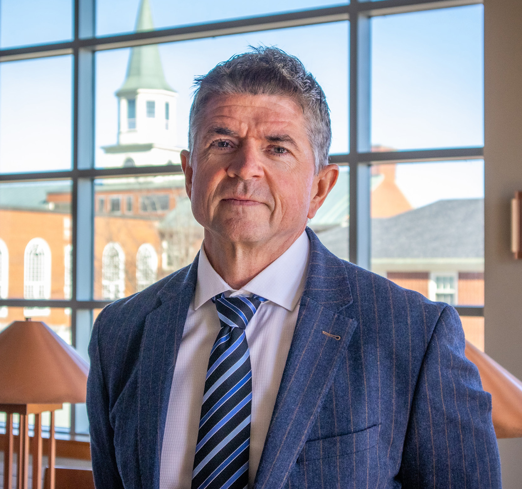 Vaughn Sturgeon sits in study hall with campus in the background