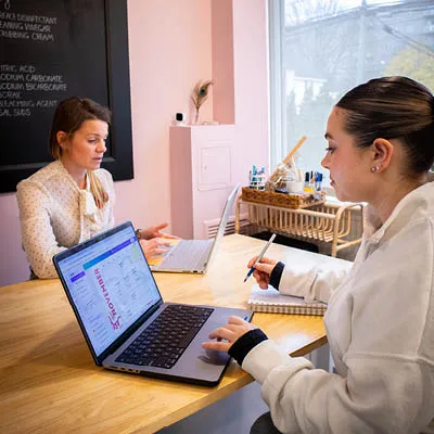 student and employer sitting at computers