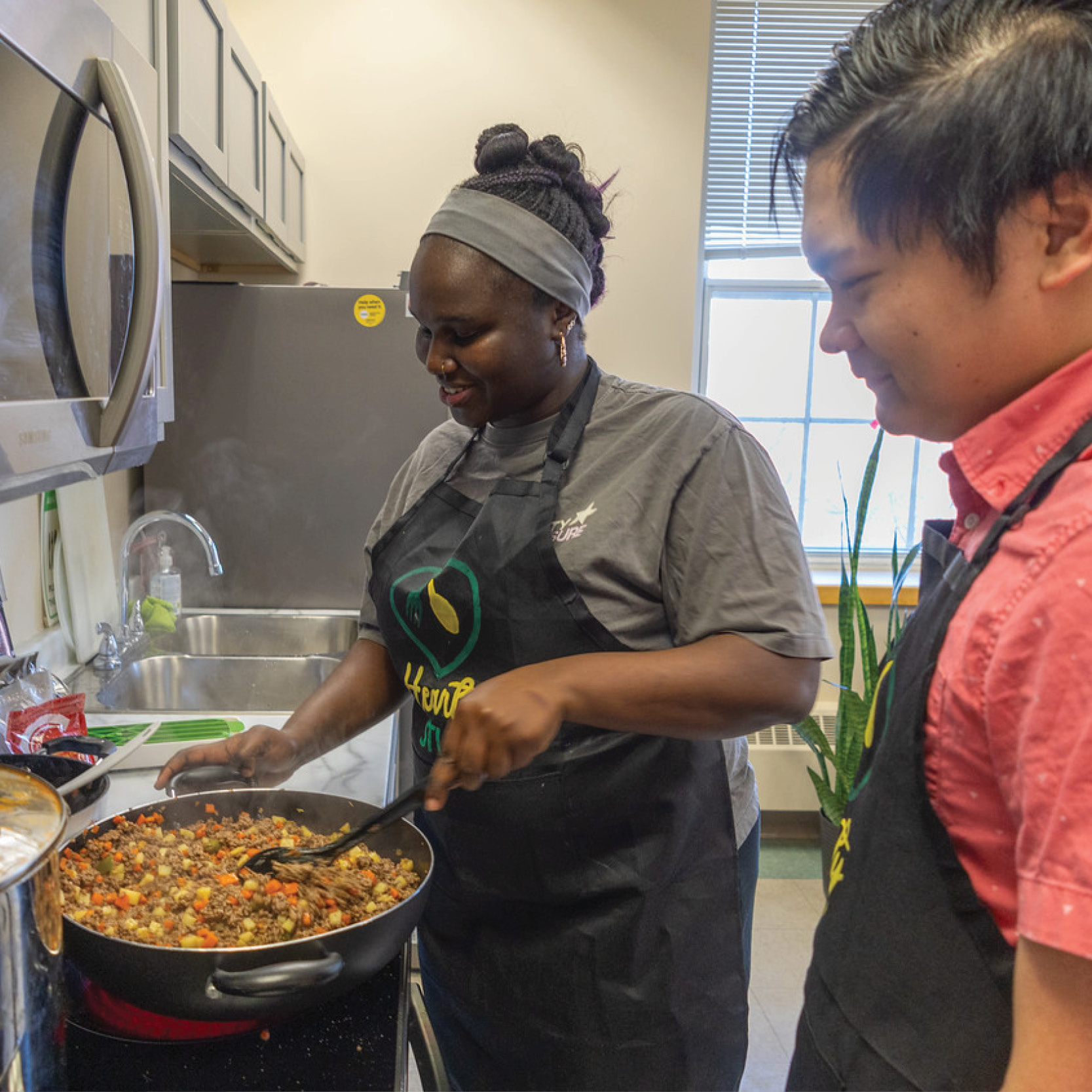 Two students cooking in the wabanaki centre