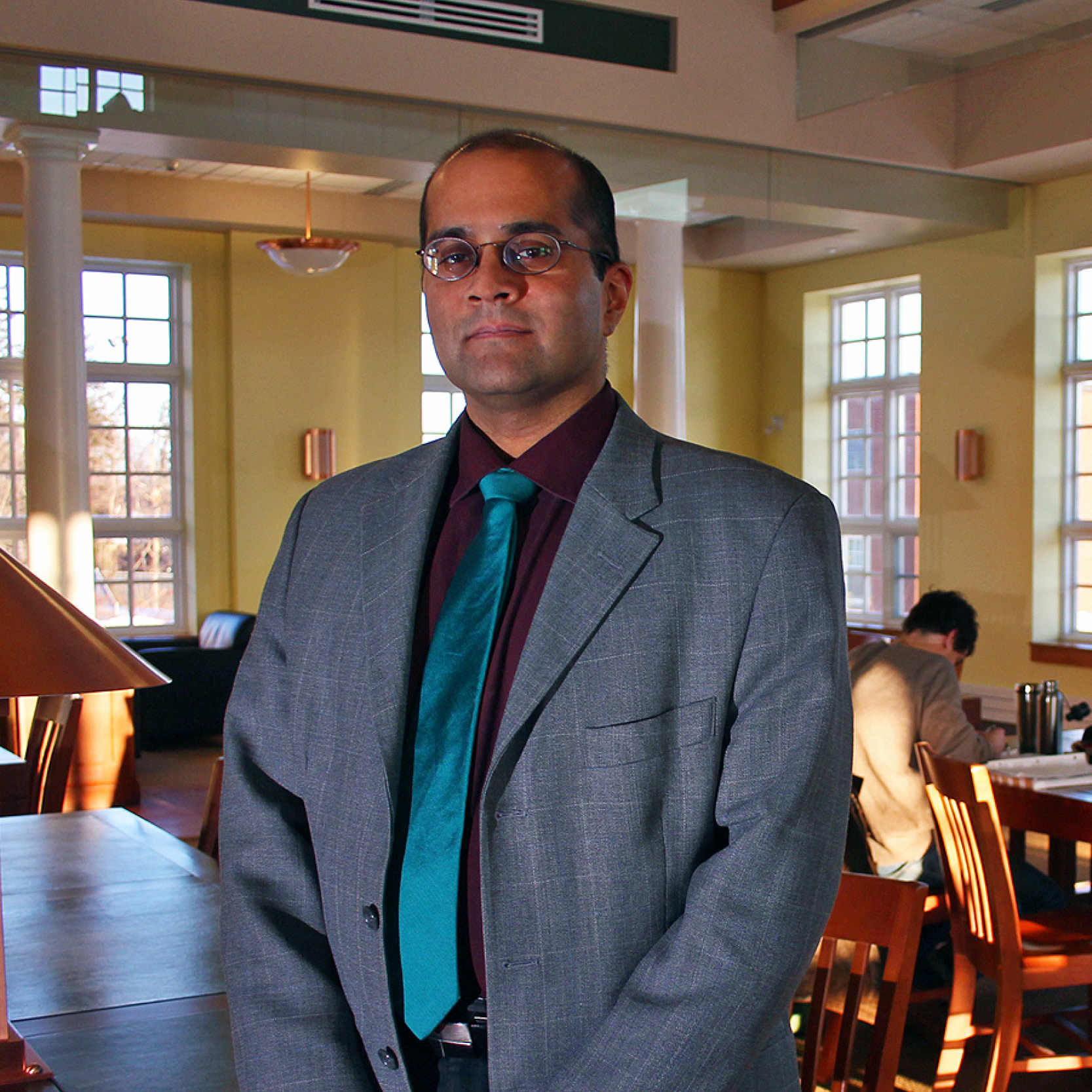 a professor standing in the study hall