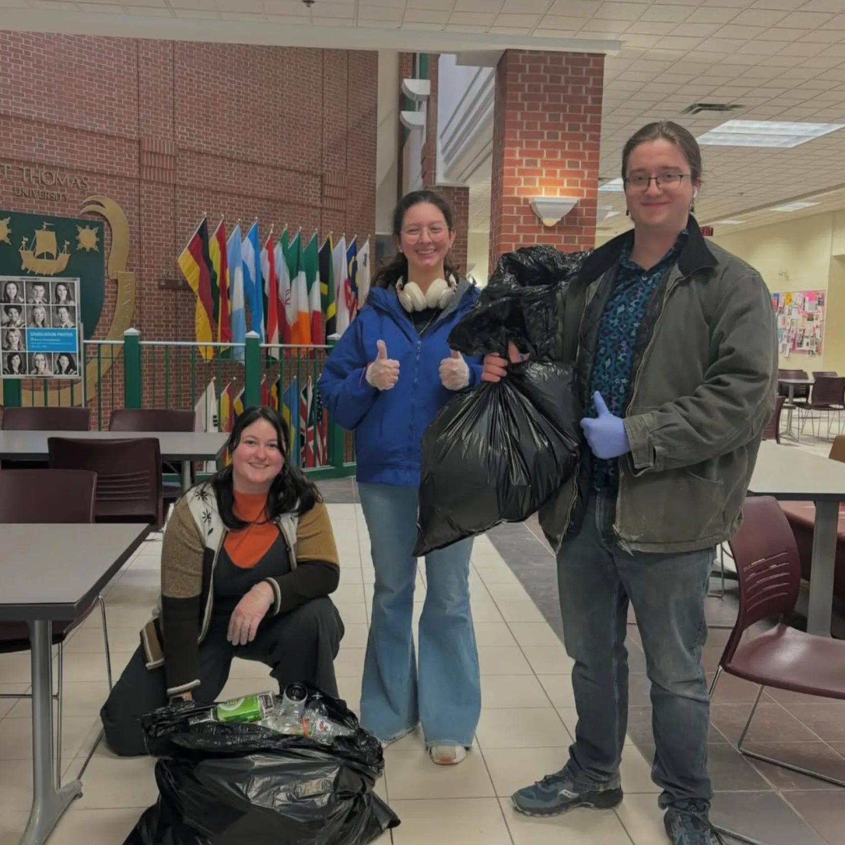 students holding bags of bottles