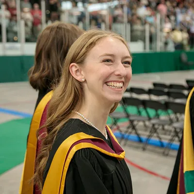 Graduating students smiling