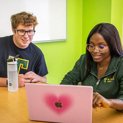 students sitting at a computer
