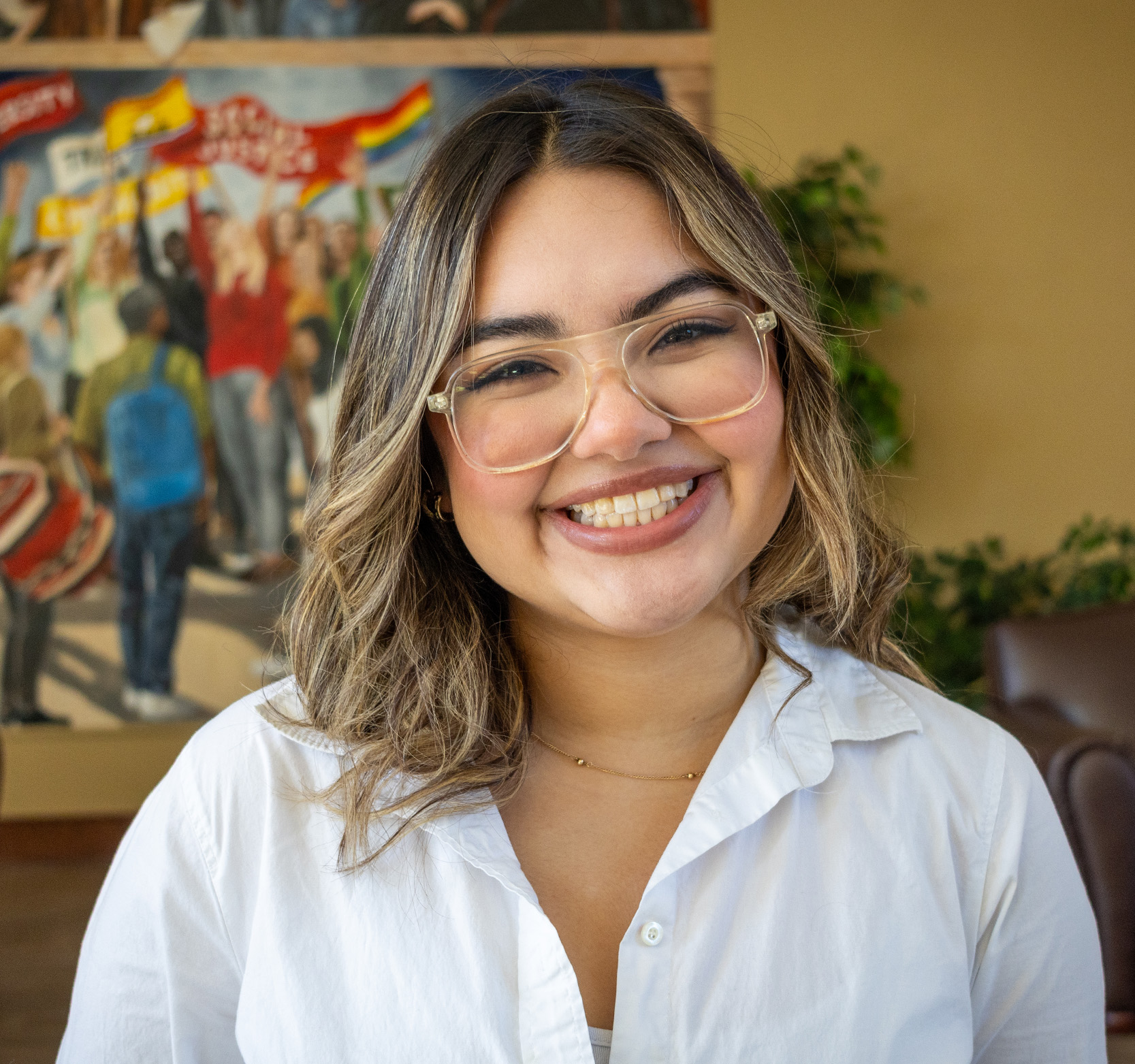 Picture of Fernanda next to the the Great Hall mural