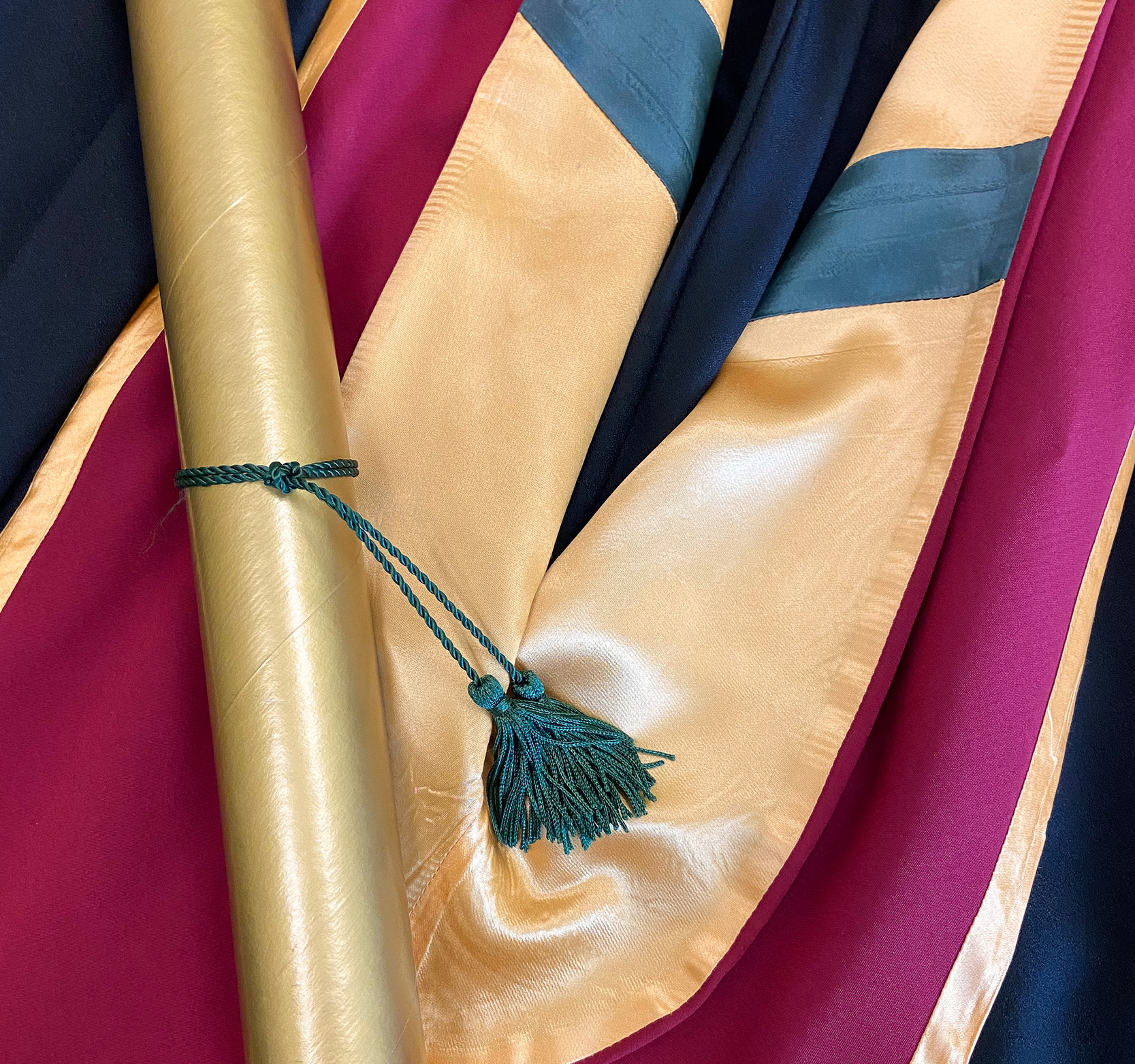 Gown, hood, and diploma
