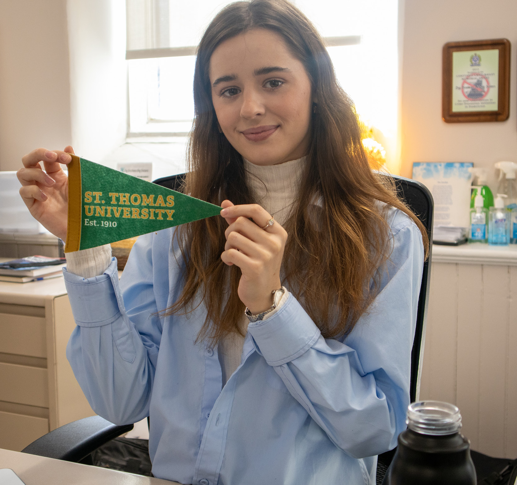 Student sitting in office at internship placement