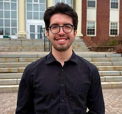 Alberto Chavez in front of George Martin Hall
