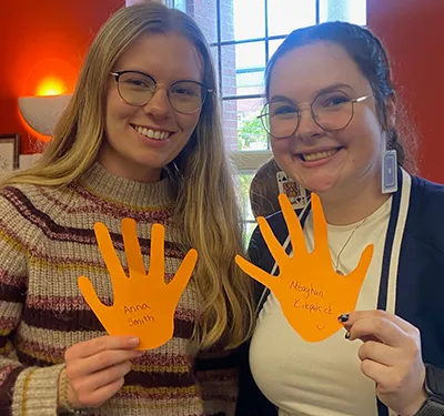 Two BEd students working on TRC display