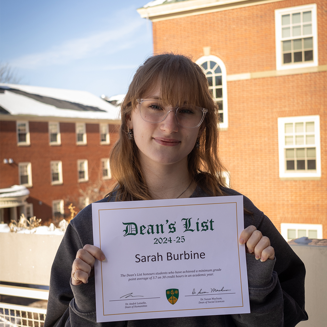 Sarah Burbine holding her Deans' List certificate