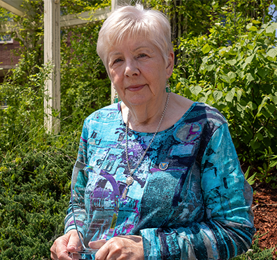 Dr. Marilyn Dupre holding the Raoul Léger Memorial Award