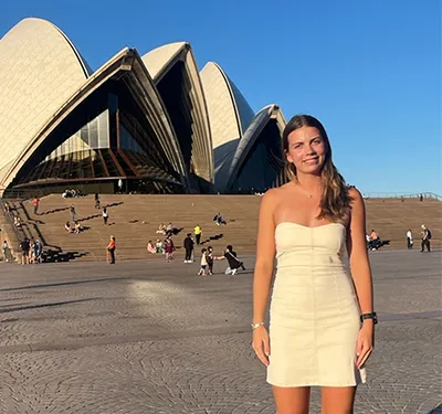 Grace Christie standing in front of the Sydney Opera House
