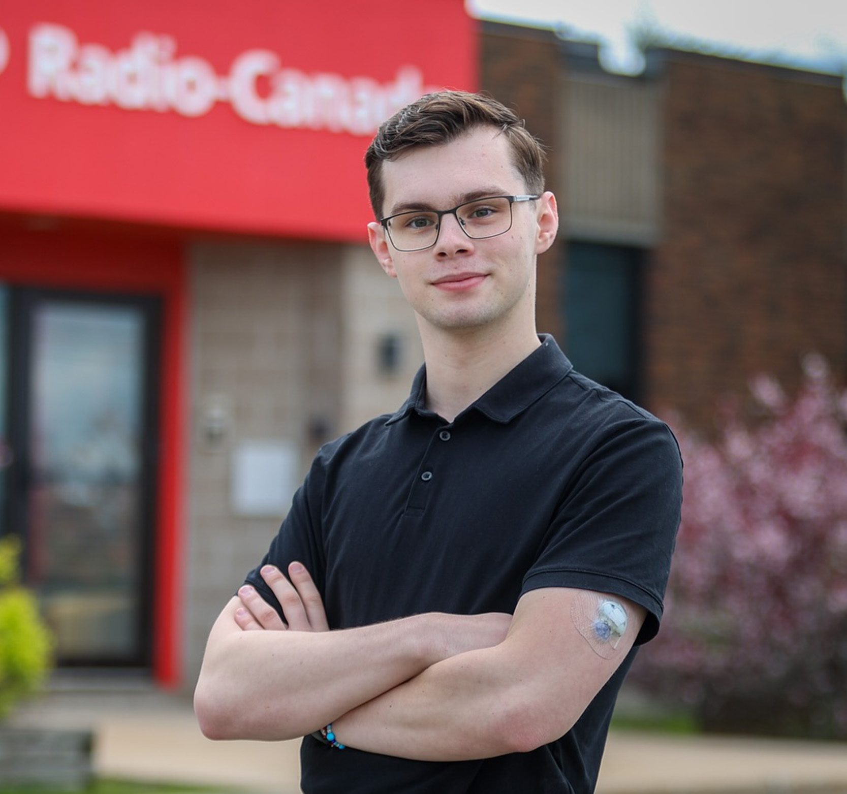 Ian Curran standing in front of CBC building